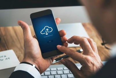 closeup-businessman-using-smartphone-with-cloud-computing-symbol_53876-12163
